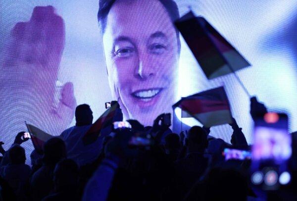 Munich Car Attack Intensifies Spotlight on Immigration in German Election | USNN World News Tech billionaire Elon Musk speaks live via a video transmission during the election campaign launch rally of AfD, supporters on Jan. 25, 2025, in Halle, Germany. (Sean Gallup/Getty Images)