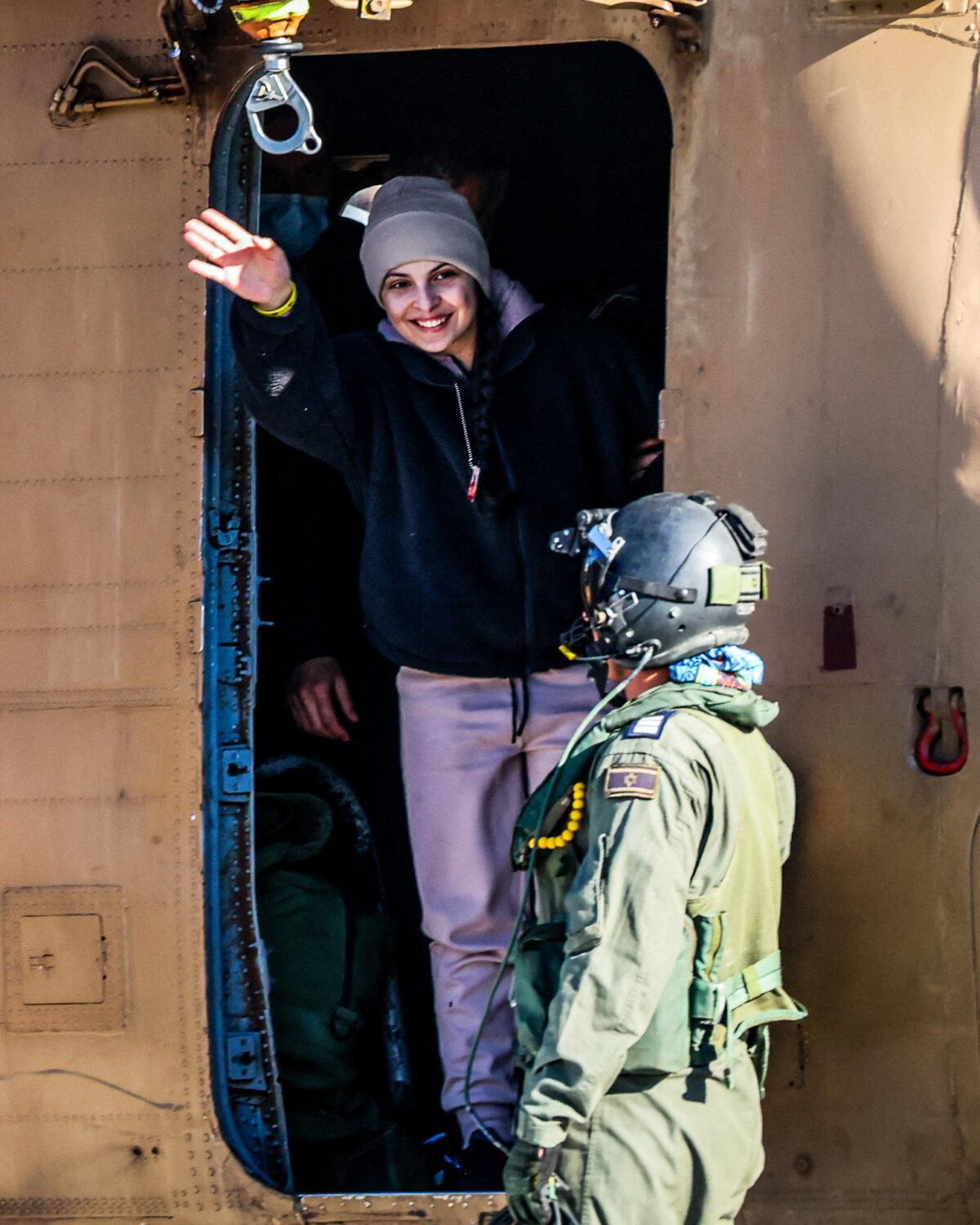 Newly released Israeli hostage Daniella Gilboa, waves as she leaves a military helicopter upon landing at the Beilinson Hospital in Petah Tikva, Israel, on Jan. 25, 2025. (Yossi Zamir/AFP via Getty Images)