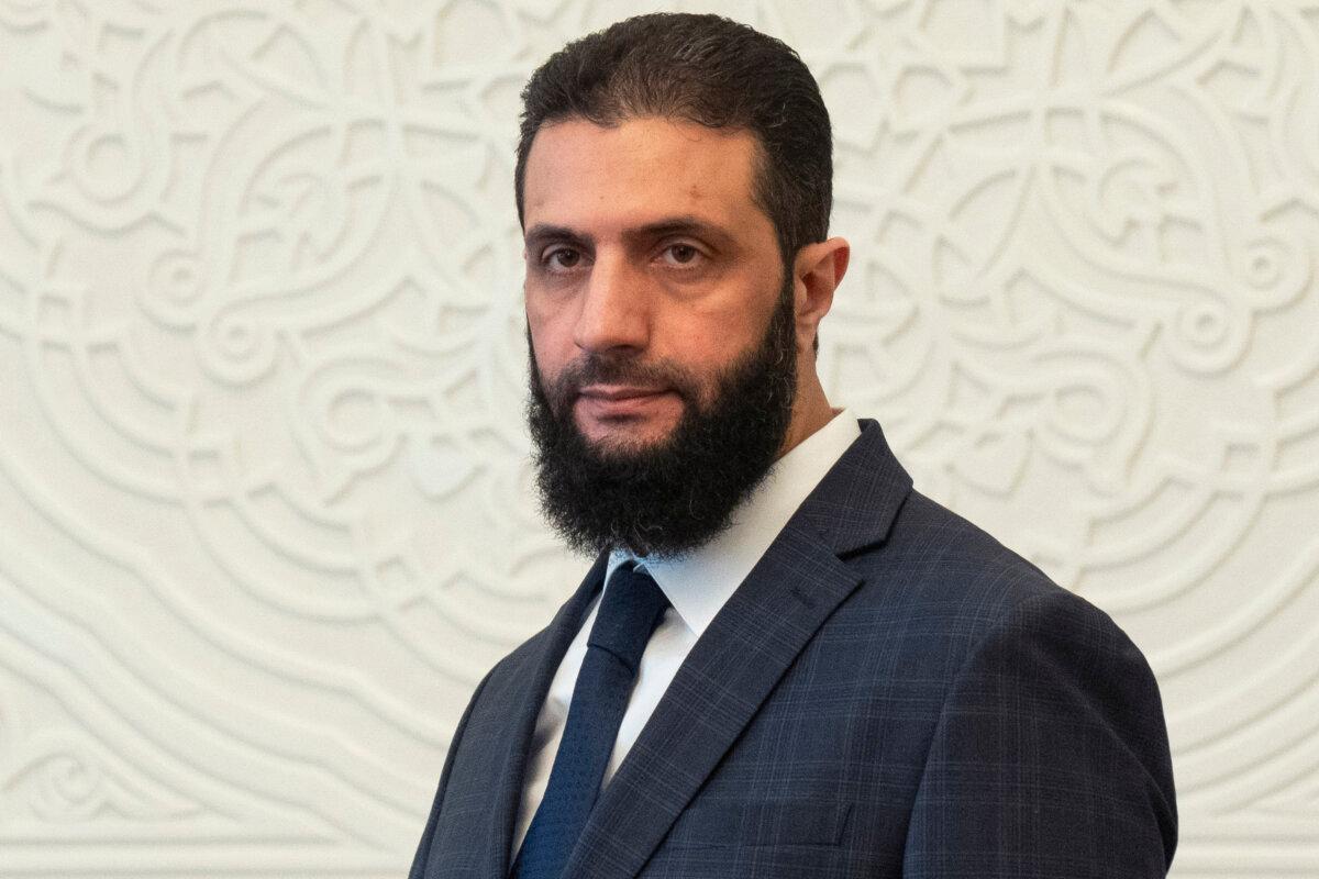 Syria's de facto leader, Ahmad al-Sharaa, formerly known as Abu Mohammed al-Golani, walks in the presidential palace in Damascus, Syria, on Dec. 28, 2024. (Mosa'ab Elshamy/AP Photo)