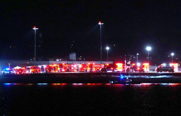 Emergency response units wait on the tarmac as search and rescue operations are underway in the Potomac River at Ronald Reagan Washington Airport in Arlington, Va., on Jan. 29, 2025. (Andrew Harnik/Getty Images)