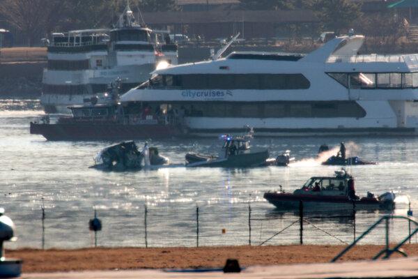 Emergency response units search the wreckage of an American Airlines plane on the Potomac River after it collided midair with a military Black Hawk helicopter on Jan. 29 on approach to Reagan National Airport, in Arlington, Va., on Jan. 30, 2025. (Alex Wong/Getty Images)