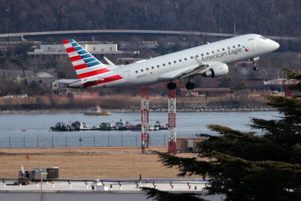 An American Eagle flight takes off from Reagan National Airport near where emergency crews work in the Potomac River on the crash site of an American Airlines plane in Crystal City, Va., on Jan. 30, 2025. (Kayla Bartkowski/Getty Images)