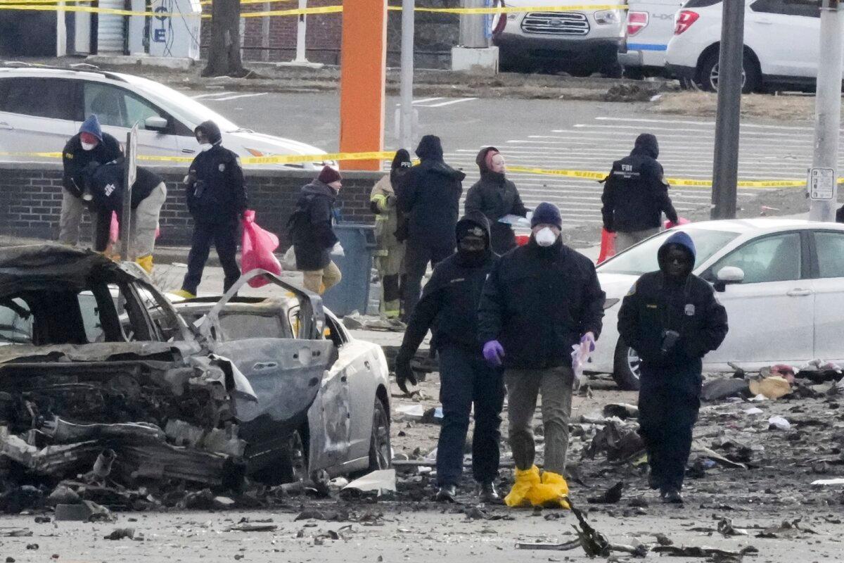 Investigators work the scene after a Jan. 31 small plane crash in Philadelphia, on Feb. 1, 2025. (Matt Rourke /AP Photo)