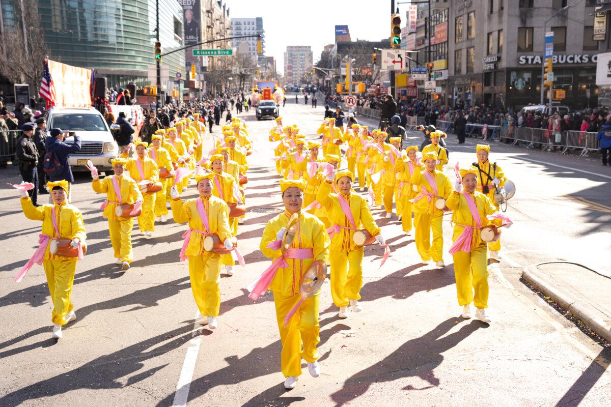 Falun Gong practitioners take part in the parade in the Flushing neighborhood of Queens, N.Y., on Feb. 1, 2025. (Larry Dye/The Epoch Times)