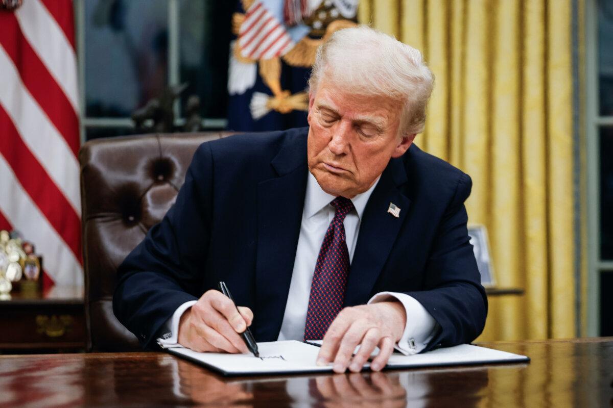 President Donald Trump signs executive orders in the Oval Office of the White House in Washington on Jan. 20, 2025. (Anna Moneymaker/Getty Images)