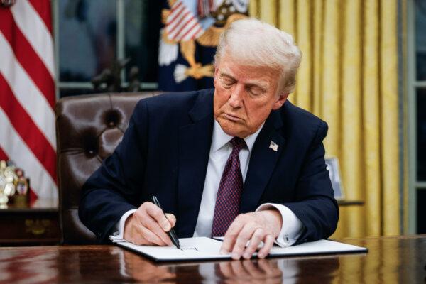 President Donald Trump signs executive orders in the Oval Office of the White House on Jan. 20, 2025. (Anna Moneymaker/Getty Images)