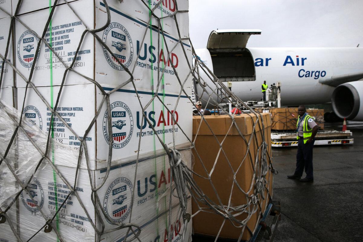 Workers unload medical supplies to fight the Ebola epidemic from a USAID cargo flight in Harbel, Liberia, on Aug. 24, 2014. (John Moore/Getty Images)