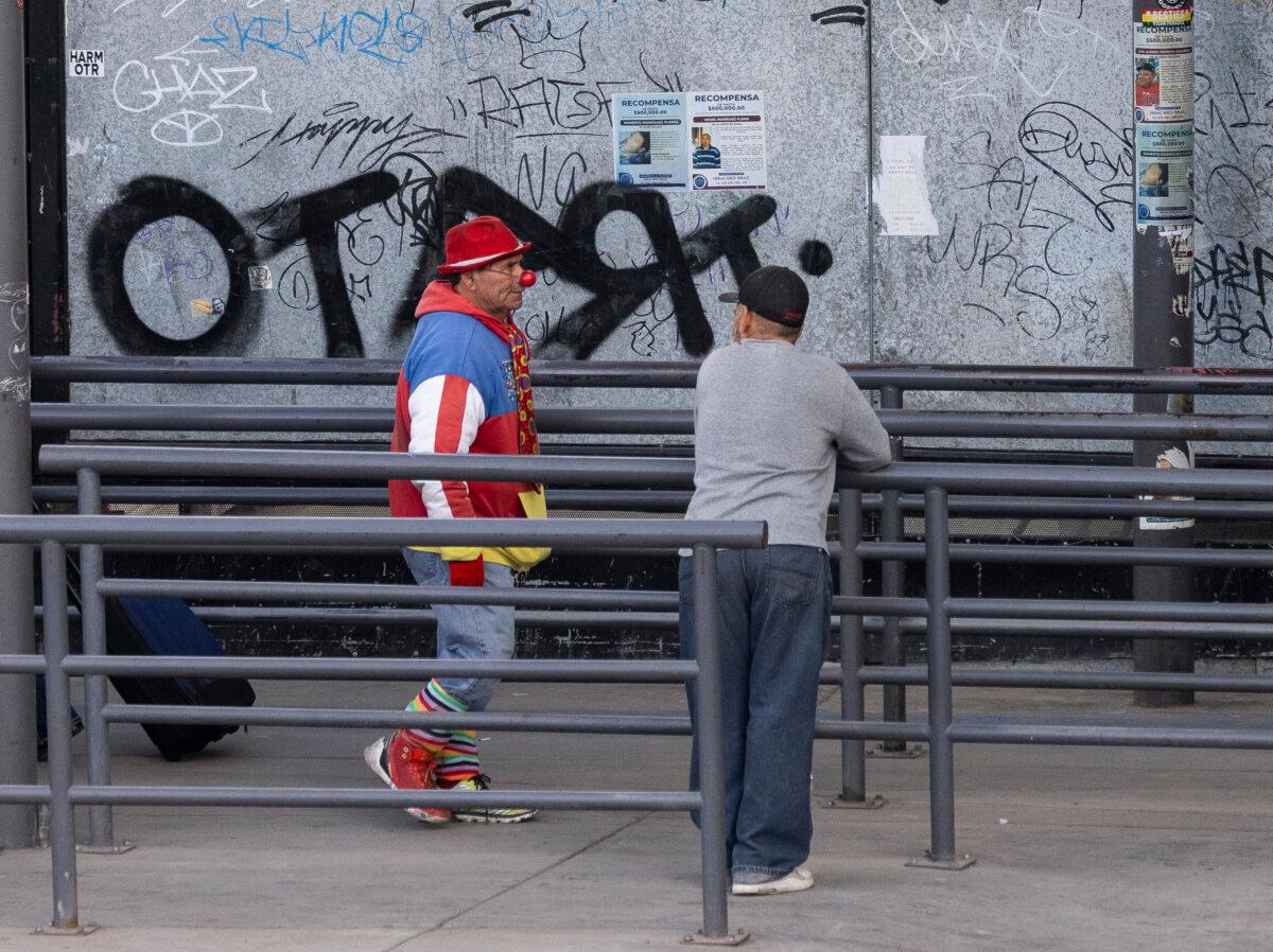 A couple people prepare to enter the United States from Tijuana, Mexico into San Ysidro, Calif., on Jan. 29, 2025. (John Fredricks/The Epoch Times)