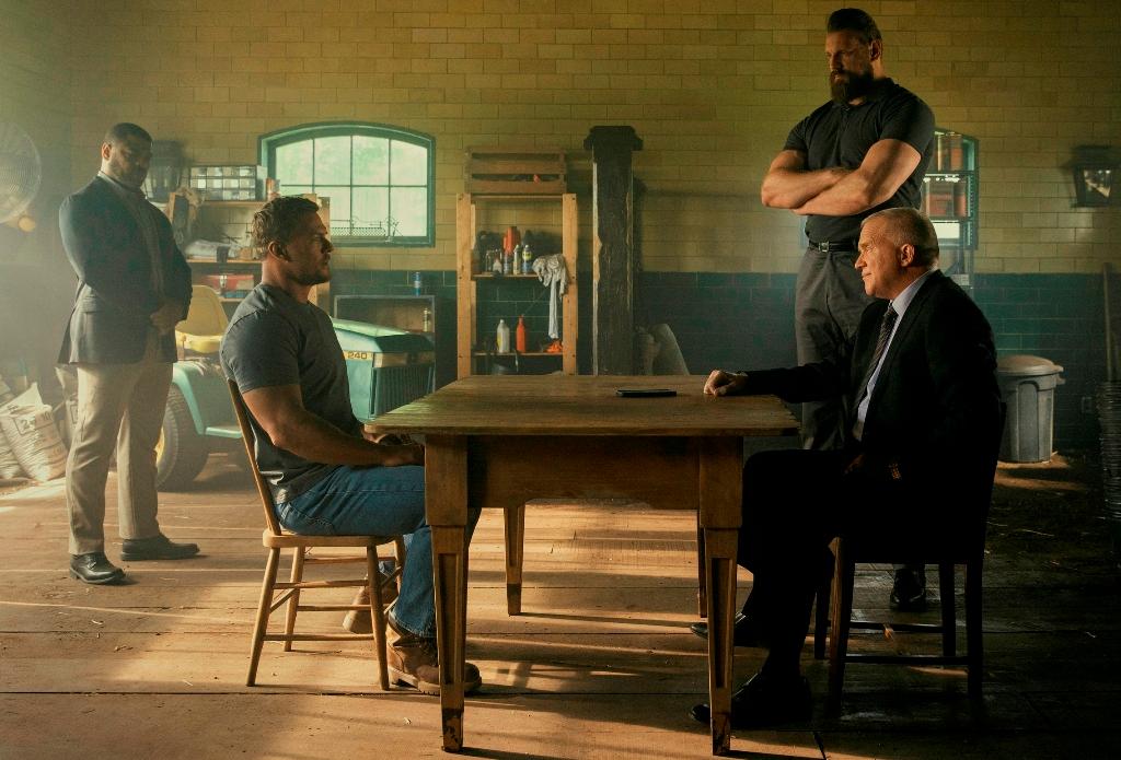 (L–R) Chapman Duke (Donald Sales), Jack Reacher (Alan Ritchson), Paulie (Olivier Richters), and Zachary Beck (Anthony Michael Hall), in "Reacher." (Amazon Prime)