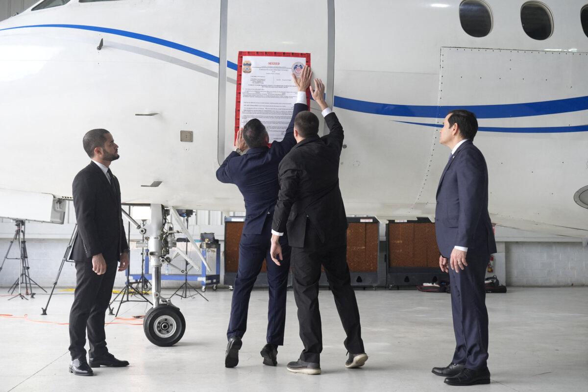 A "seized" sign is placed on a Venezuelan government airplane during a press conference where U.S. Secretary of State Marco Rubio announced its seizure at La Isabela International Airport in Santo Domingo, Dominican Republic, on Feb. 6, 2025. (Mark Schiefelbein/Pool via Reuters)