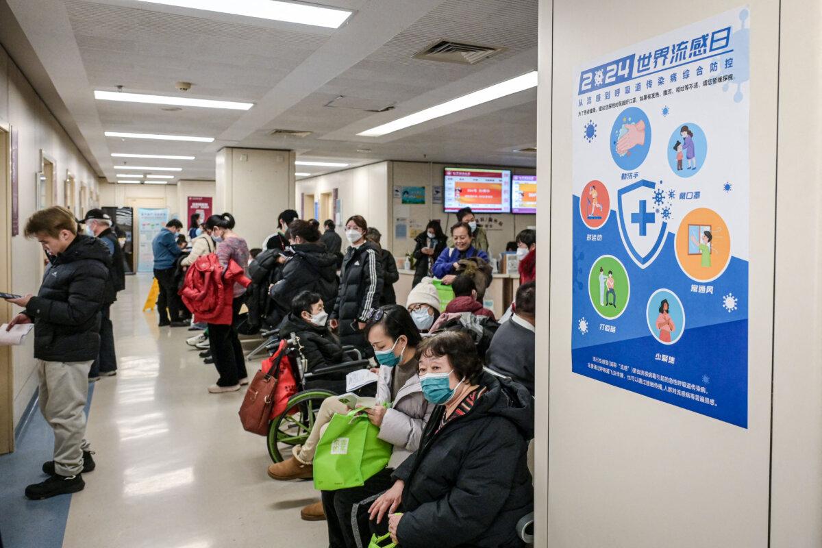 People wait at an outpatient area of the respiratory department of a hospital in Beijing on Jan. 8, 2025. (Jade Gao/AFP via Getty Images)