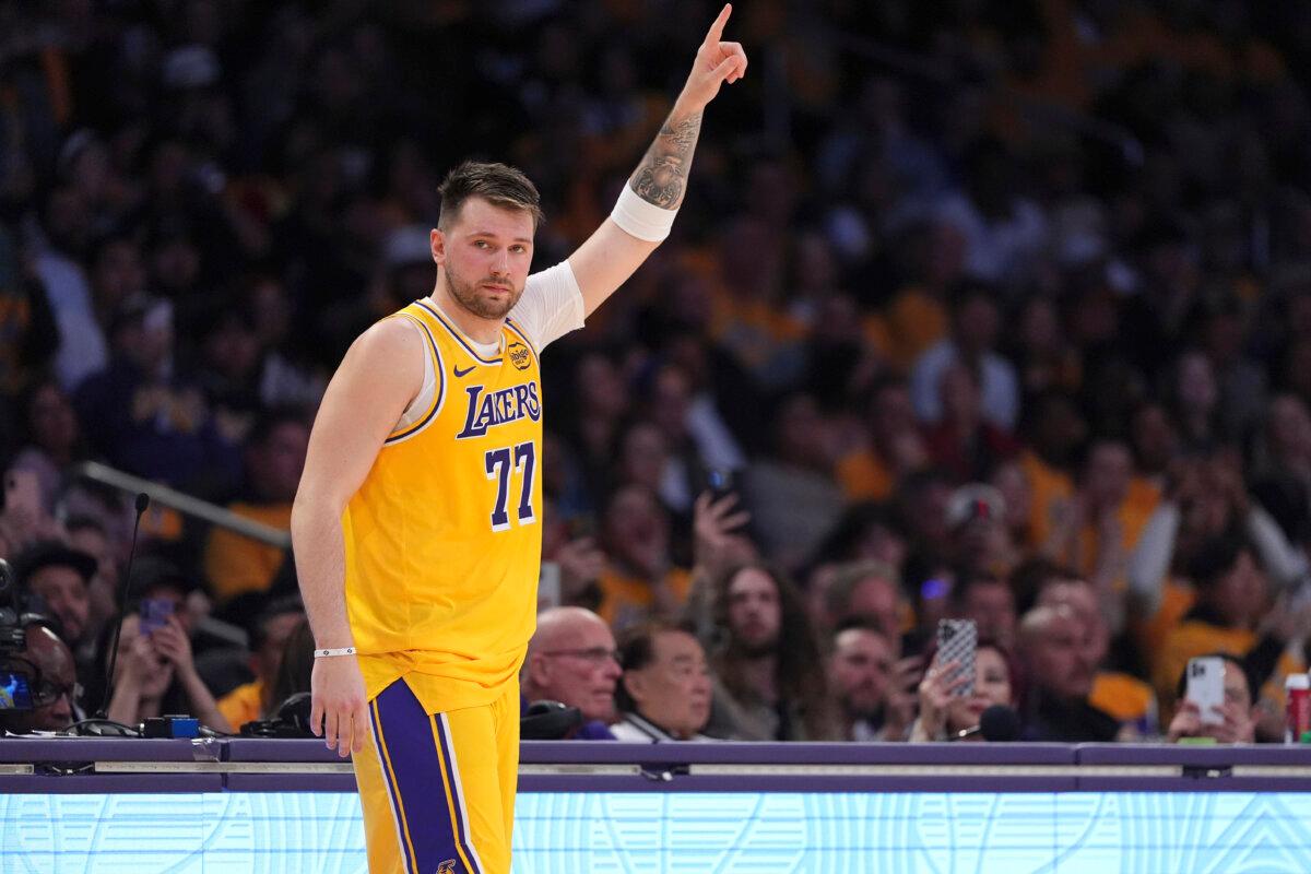 Los Angeles Lakers guard Luka Doncic gestures as he comes back in during the first half of an NBA basketball game against the Utah Jazz in Los Angeles on Feb. 10, 2025. (Mark J. Terrill/AP Photo)
