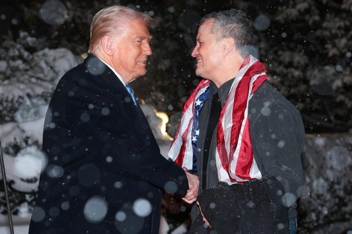 As snow falls, President Donald Trump welcomes Marc Fogel back to the United Stated after Fogel was released from Russian custody, at the White House on Feb. 11, 2025. (Win McNamee/Getty Images)