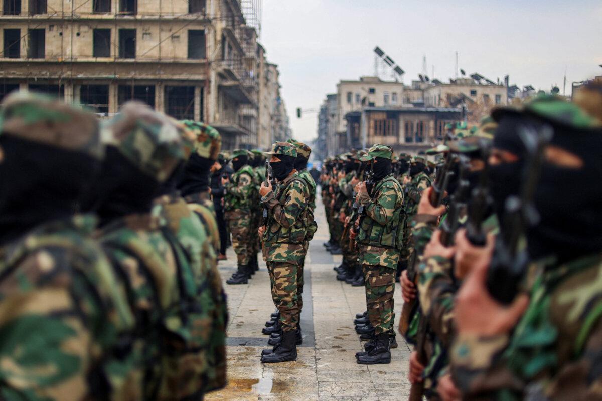 Graduates of Syria's General Security forces under the country's new administration attend a ceremony in the northern city of Aleppo on February 12, 2025. (Photo by Aaref Watad/AFP via Getty Images)