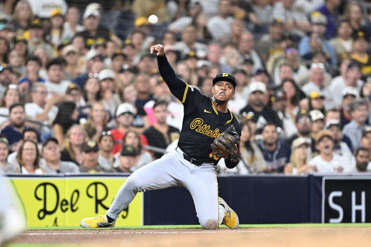 Ke'Bryan Hayes (13) of the Pittsburgh Pirates throws to first base in a baseball game against the San Diego Padres at Petco Park in San Diego on Aug. 12, 2024. (Denis Poroy/Getty Images)