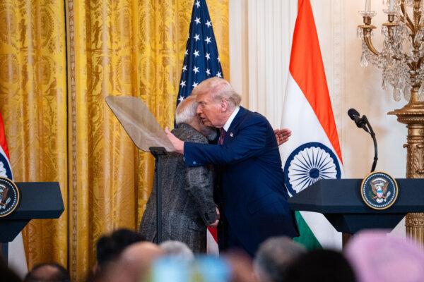 U.S. President Donald Trump greets Indian Prime Minister Narendra Modi during a press conference at the White House in Washington on Feb. 13, 2025. (Madalina Vasiliu/The Epoch Times)