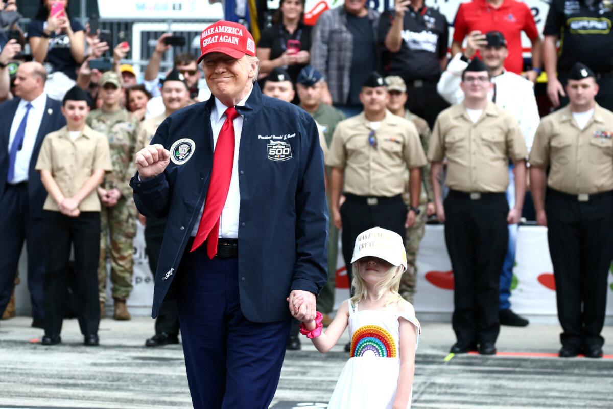 President Donald Trump is standing on the grid in front of the Nascal Cup Series Daytona 500 on February 16, 2025 at Daytona International Speedway in Daytona Beach, Florida.