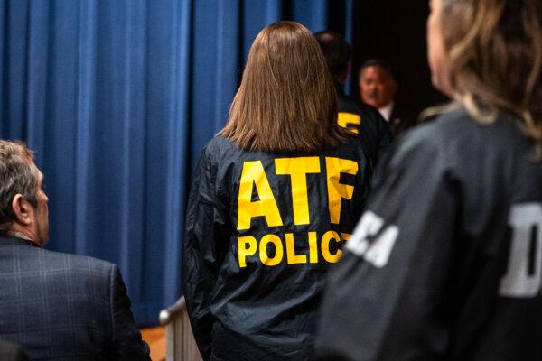 A Bureau of Alcohol, Tobacco, Firearms and Explosives (ATF) agent at the Department of Justice in Washington on Feb. 12, 2025. (Madalina Vasiliu/The Epoch Times)