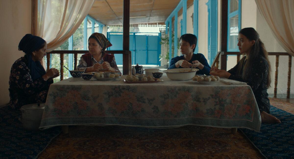 Dilber (Guzalnur Uchqun, R) with actors who remain anonymous, in “Nikah.” (Icarus Films)