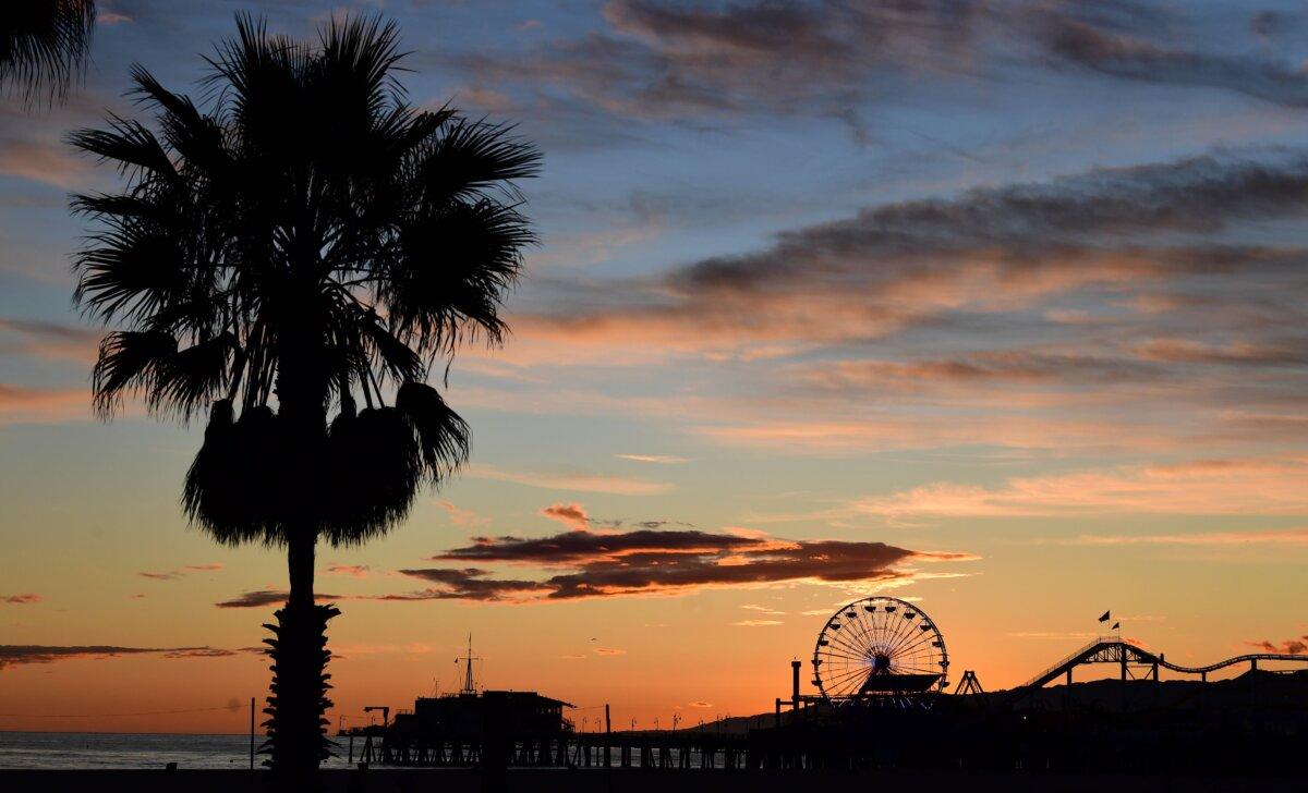 Santa Monica Pier after sunset in Santa Monica, Calif., on April 10, 2020. City leaders are hoping a new entertainment zone will help bring people back downtown for shopping, dining, and other experiences. (Frederic J. Brown/AFP via Getty Images)