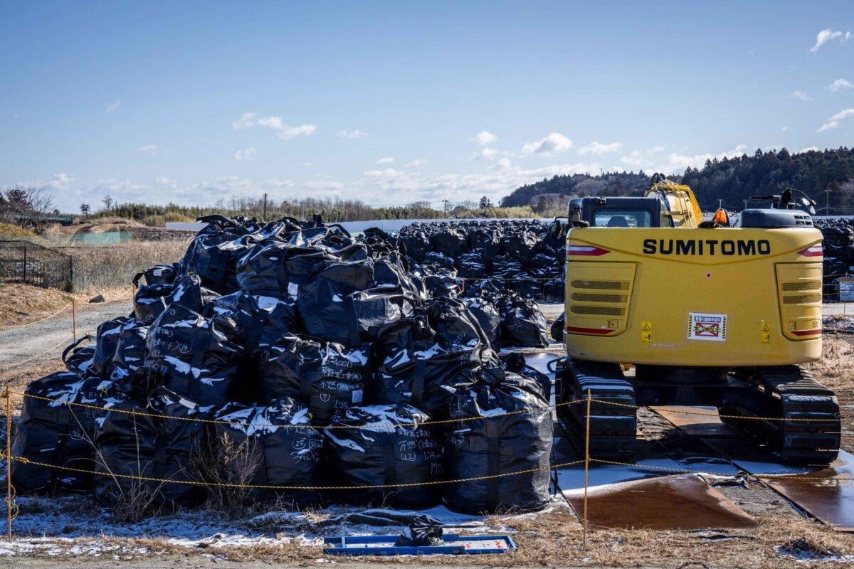 Japan to Resume Operations at World’s Largest Nuclear Plant 15 Years After Fukushima Disaster | USNN World News Bags of radiation-contaminated soil are gathered at a temporary storage field in Okuma town of Fukushima prefecture on Feb. 19, 2025. (Yuichi Yamazaki / AFP via Getty Images)