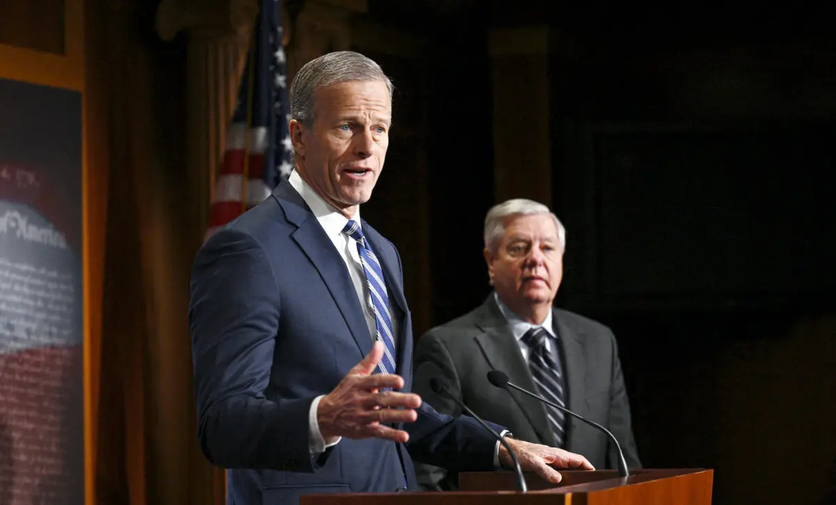 Sen. John Thune (R-S.D.) joins Senate Judiciary ranking member Lindsey Graham (R-S.C.) for a news conference on the Biden administration's "abuse of the immigration parole system" at the U.S. Capitol in Washington on Jan. 17, 2024. (Brendan Smialowski/AFP)