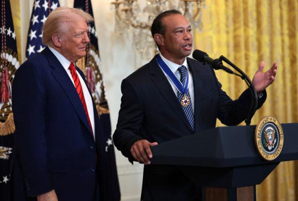 Golf legend Tiger Woods speaks alongside U.S. President Donald Trump during a reception honoring Black History Month in the East Room of the White House in Washington on Feb. 20, 2025. (Win McNamee/Getty Images)