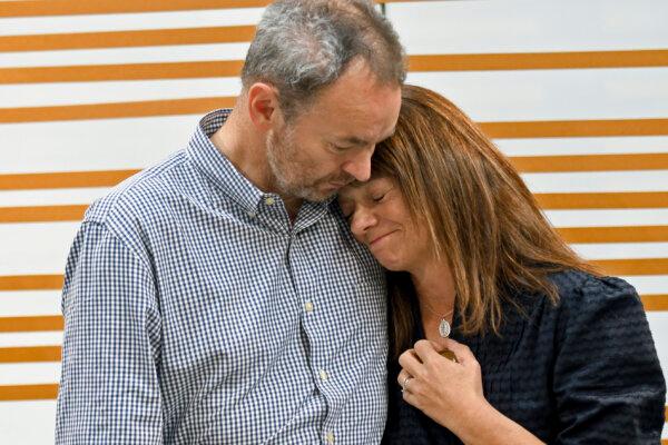 Simon and Sally Glass comfort each other during an emotional news conference about the death of their son, Christian Glass, in Denver on Sept. 13, 2022. (Thomas Peipert/AP Photo)