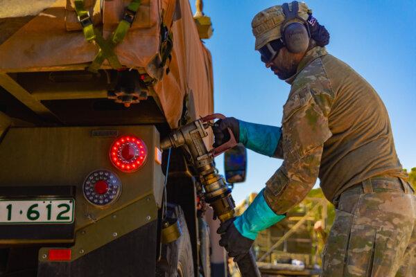 Australian Army Fuel specialists from the 1st Combat Service Support Battalion work alongside Petroleum Operators from UK's Commando Logistics Regiment to refuel Battle Group Tiger vehicles at Timber Creek, Northern Territory, during Exercise Predator's Run 2024. Courtesy ADF.
