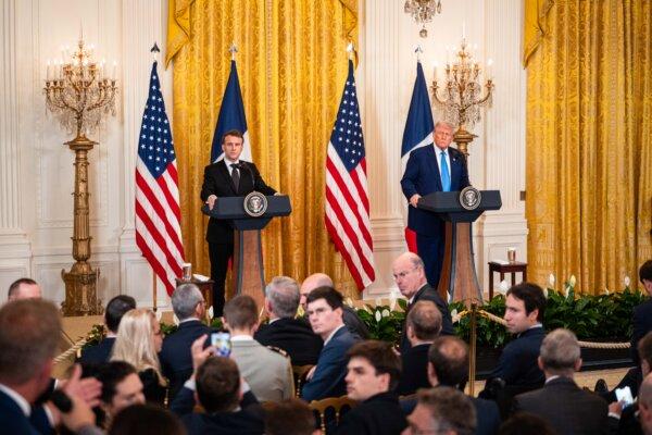 French President Emmanuel Macron and U.S. President Donald Trump speak during a news conference at the White House on Feb. 24, 2025. (Madalina Vasiliu/The Epoch Times)