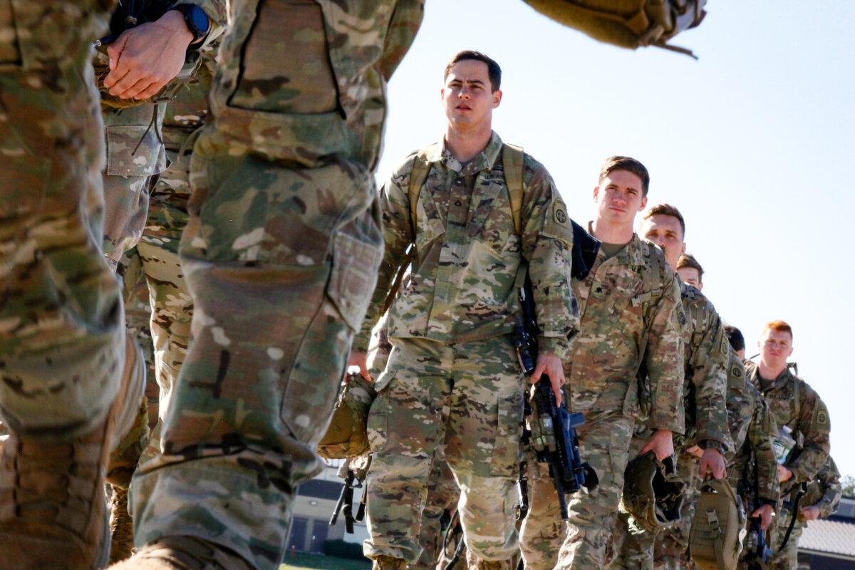 U.S. Army paratroopers assigned to 1st Brigade Combat Team, 82nd Airborne Division board an aircraft bound for the U.S. Central Command area of operations from Fort Bragg, N.C., on Jan. 5, 2020. (U.S. Army/Spc. Hubert Delany III/Handout via Reuters)
