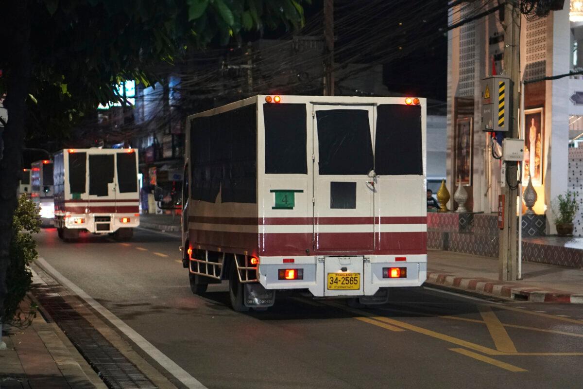 This photo provided by Thailand's daily web newspaper Prachatai shows trucks with black tape covering the windows leave a detention center in Bangkok, Thailand, on Feb. 27, 2025. (Nuttaphol Meksobhon/Prachatai via AP)