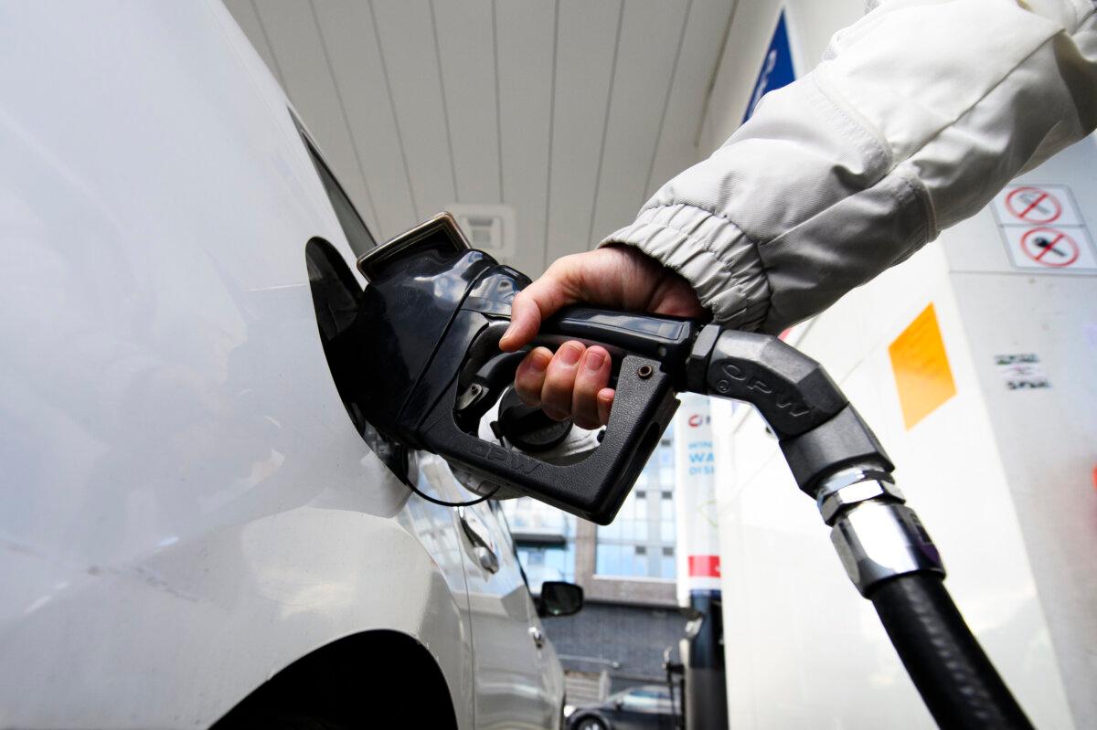 A woman gases up at a gas station in Mississauga, Ont., in a file photo. (The Canadian Press/Christopher Katsarov)