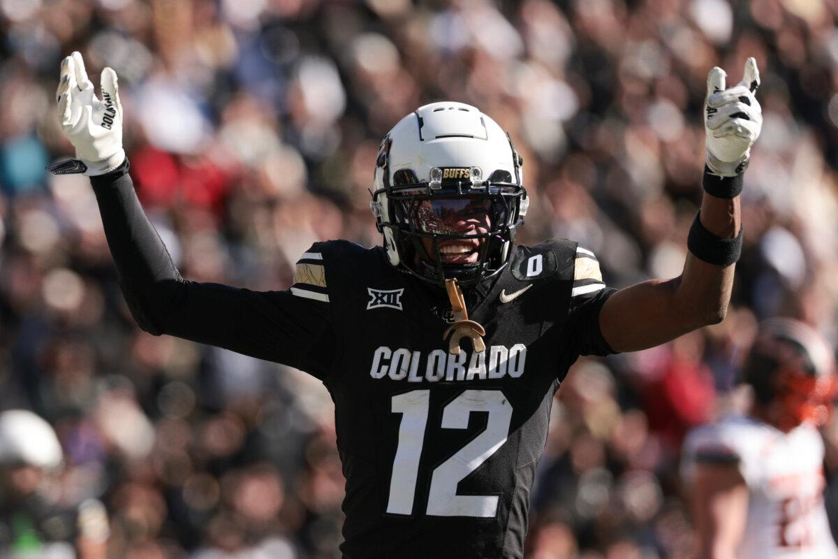 Travis Hunter #12 of the Colorado Buffaloes celebrates a touchdown during the third quarter against the Oklahoma State Cowboys at Folsom Field in Boulder, Colorado on November 29, 2024. (Andrew Wevers/Getty Images)