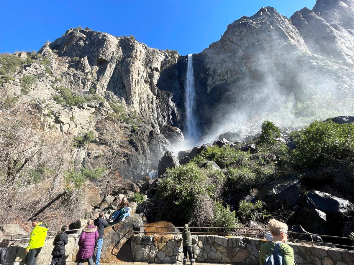 Visitors take in a view of Bridalveil Fall in Yosemite National Park, Calif., on Feb. 20, 2025. (Haven Daley/AP)