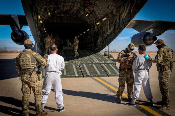 The first U.S. military aircraft to carry detained illegal immigrants to a detention facility at Guantanamo Bay in Cuba is boarded from an unspecified location in the United States on Feb. 4, 2025 (DHS via Reuters)