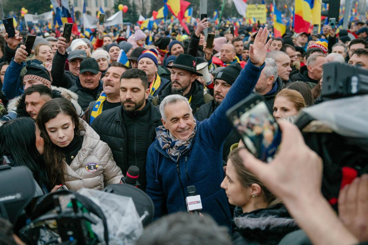 Former presidential candidate Calin Georgescu waves during an anti-government rally in Bucharest, Romania, on March 1, 2025. (Andrei Pungovschi/Getty Images)