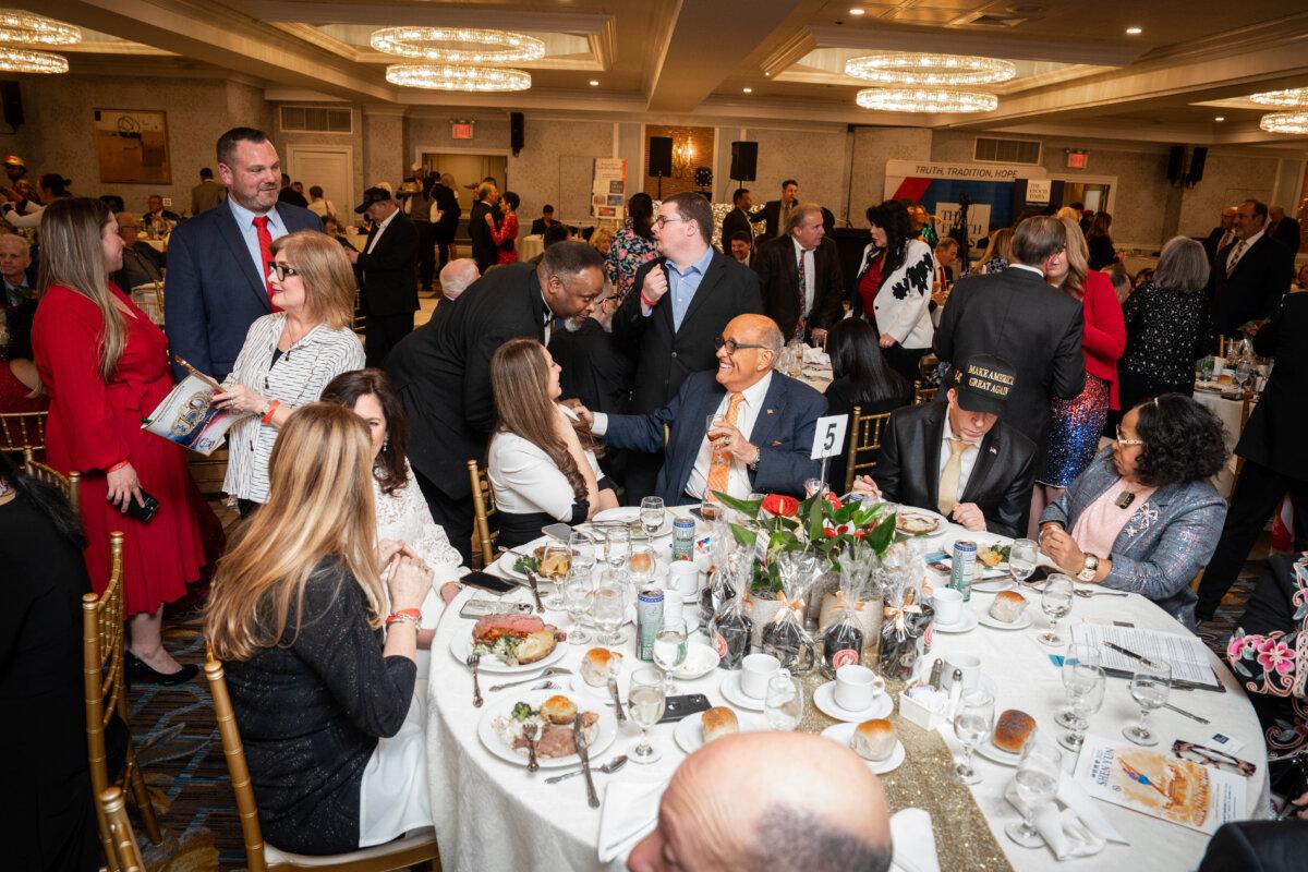 Former New York Mayor Rudy Giuliani (C) interacts with guests at the Queens Village Republican Club’s 150th Anniversary Lincoln Dinner in Queens Village, N.Y., on March 2, 2025. (Samira Bouaou/The Epoch Times)