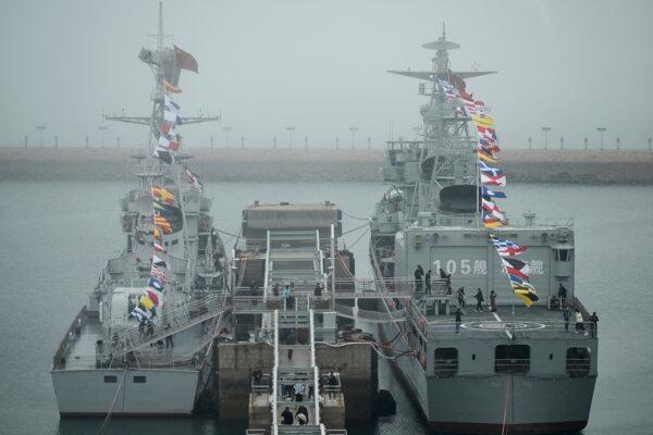 The Chinese navy's Jinan destroyer (R) at the People's Liberation Army Naval Museum in Qingdao, Shandong Province, China, on April 23, 2024. (Wang Zhao/AFP via Getty Images)