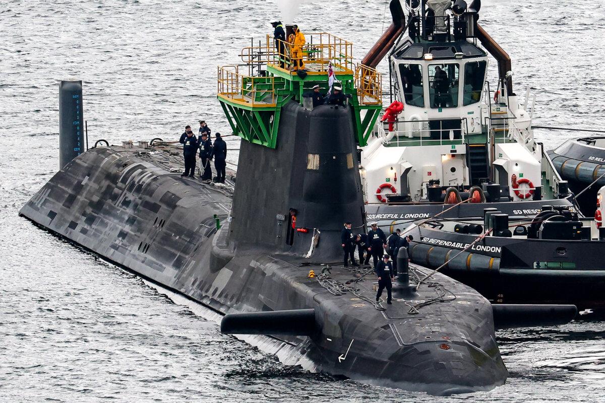 HMS Artful an Astute-class nuclear-powered fleet submarine is manoeuvred at His Majesty's Naval Base Clyde in Faslane, Scotland, on March 4, 2025. (Jeff J Mitchell/Getty Images)