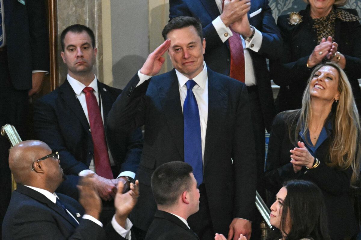 Elon Musk stands as he is recognized by US President Donald Trump during Trump's address to a joint session of Congress at the US Capitol in Washington, DC, on March 4, 2025. (Photo by SAUL LOEB / AFP)