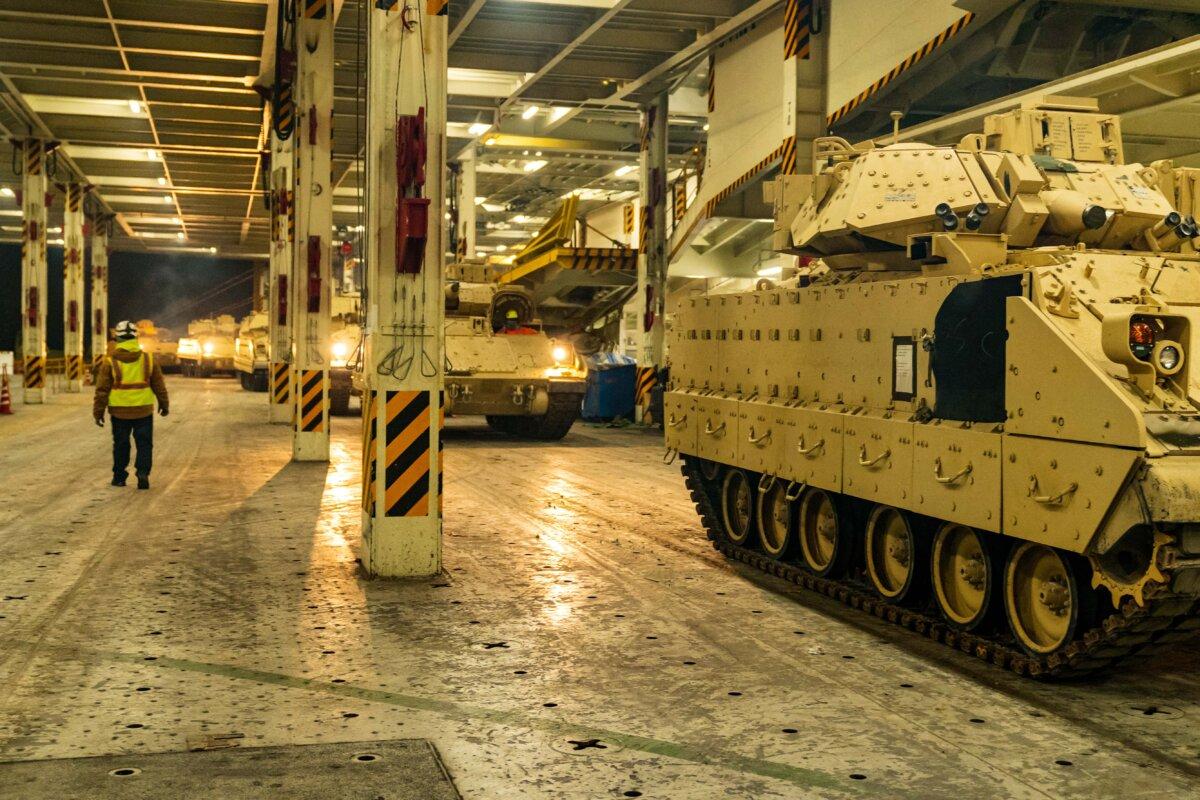 A convoy of Ukraine-bound Bradley Fighting Vehicles load onto the carrier ARC Integrity at the Transportation Core Dock in North Charleston, S.C., on Jan. 25, 2023. (U.S. Transportation Command/Oz Suguitan/Handout via REUTERS)