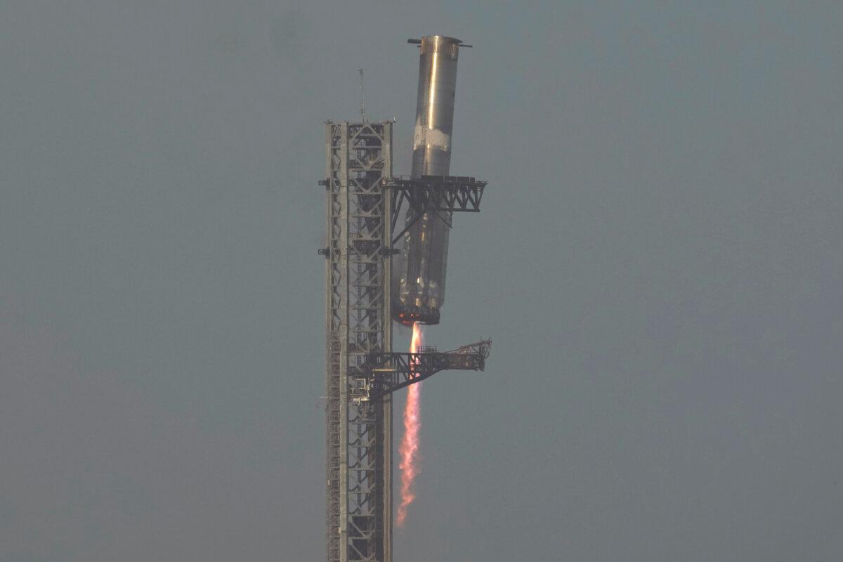 The booster of SpaceX's megarocket Starship is recaptured during a test flight from Starbase in Boca Chica, Texas, on March 6, 2025. (Eric Gay/AP Photo)