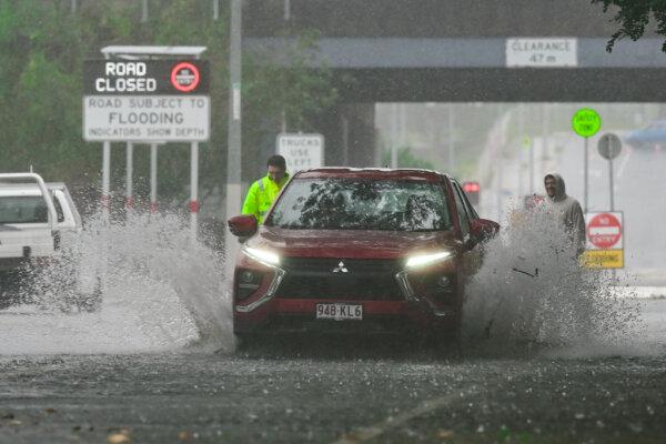 Cars drive through Widdop Street in the suburb of Clayfield in Brisbane, Australia, on March 9, 2025. (Albert Perez/Getty Images)