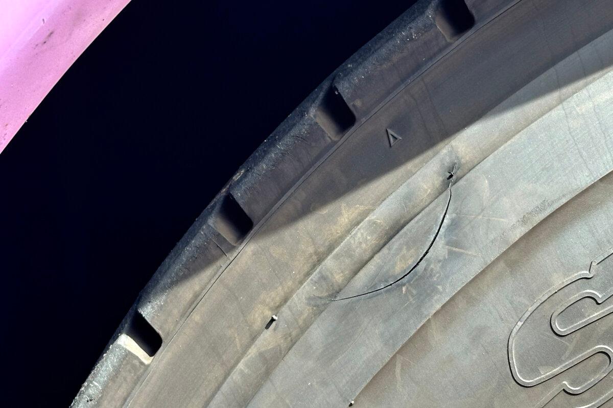 The Costa Mesa Police Department detailed an “approximately 7-inch slash on the side wall” of a tire on a Shen Yun tour bus, on March 15, 2024. The tire was cut in such a way that it wouldn’t deflate but would burst when driven on the freeway. (Courtesy of Shen Yun security)