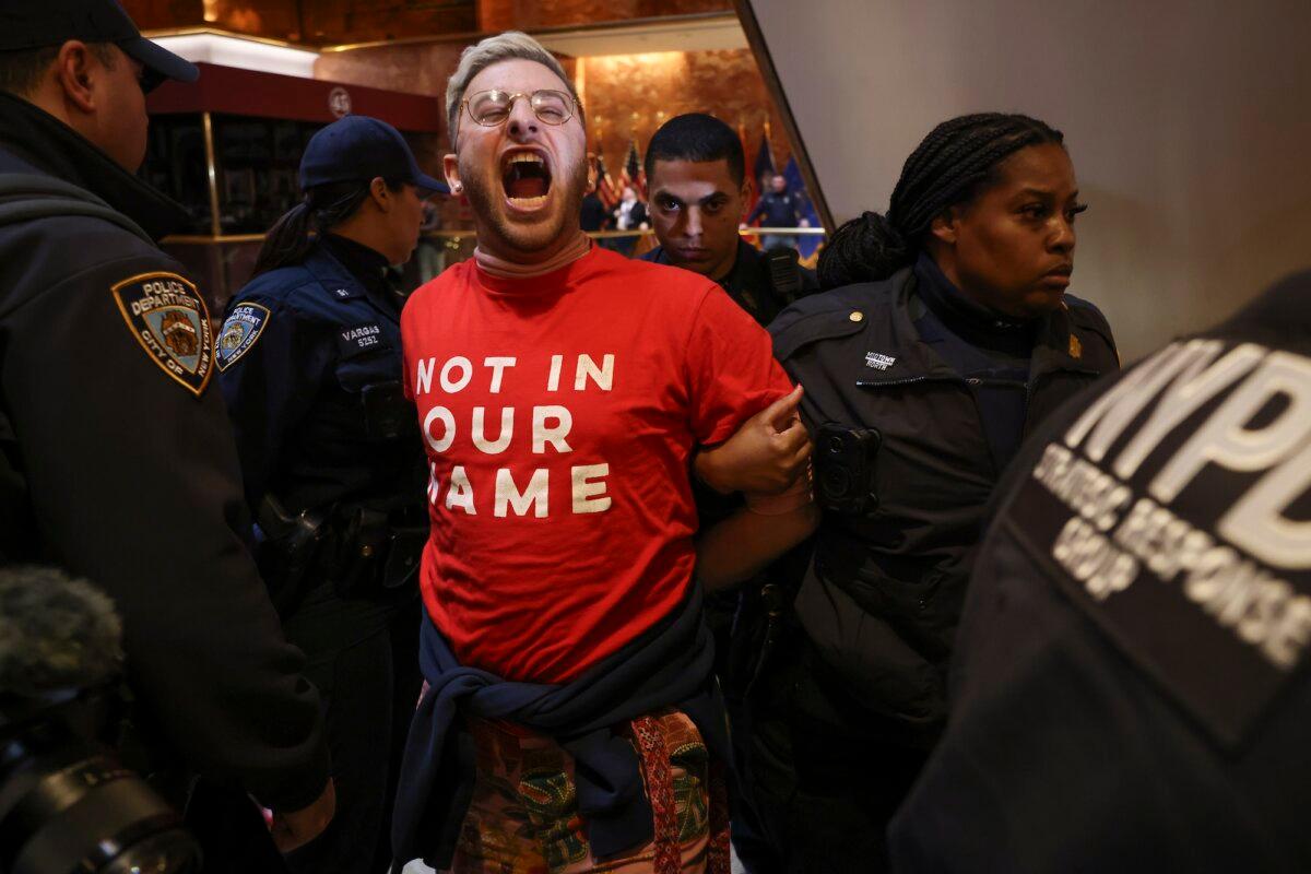 New York police arrest a demonstrator from the group Jewish Voice for Peace, who protested inside Trump Tower in support of Mahmoud Khalil, in New York, on March 13, 2025. (Yuki Iwamura / AP)
