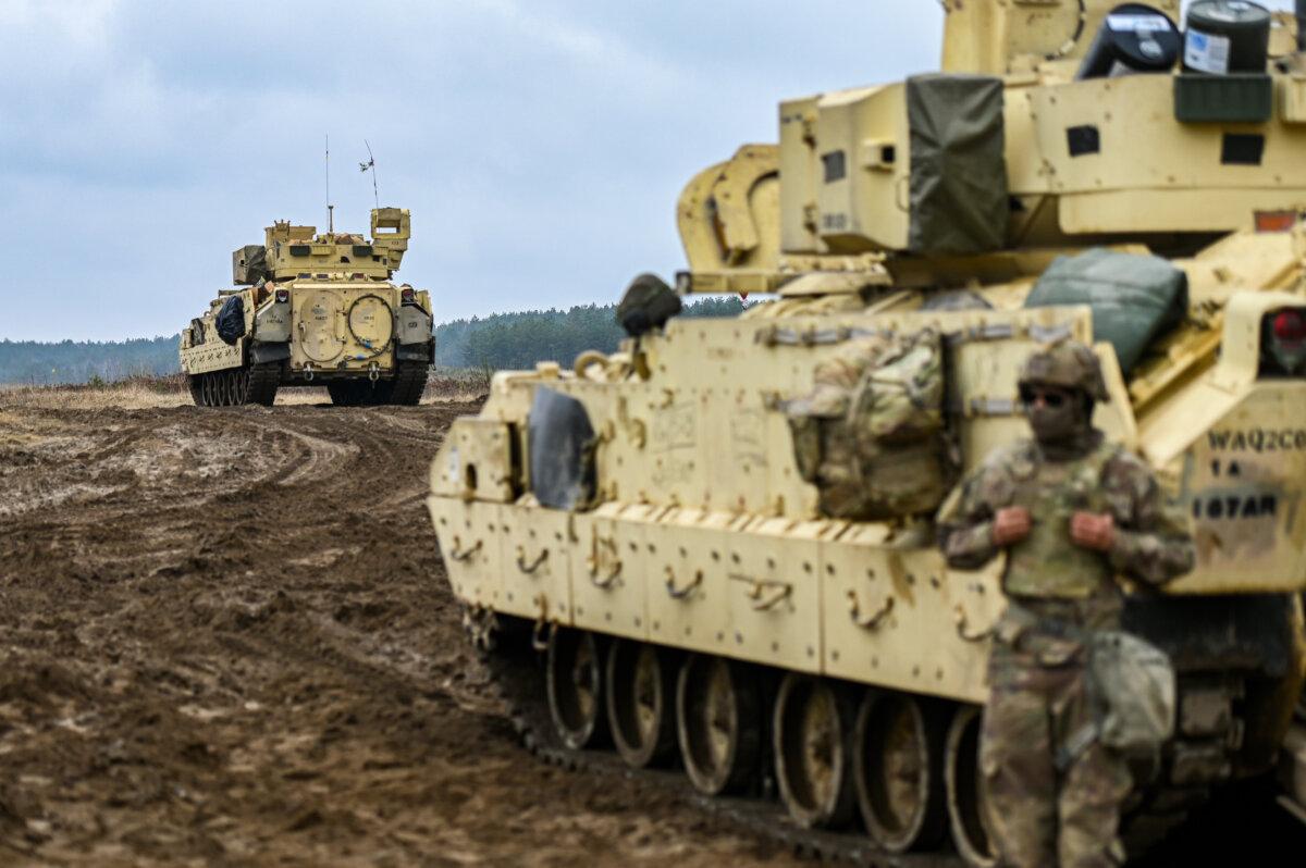 Soldiers of the US Army 3rd Brigade, 1st Armored Division, and Bradley Fighting Vehicle prepare for a live fire exercise at the Drawsko Pomorskie training area in Poland on March 13, 2025. (Omar Marques/Getty Images)