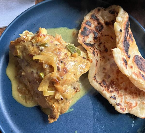 Served with homemade naan, this chicken curry is light on spices but heavy on taste. (Gretchen McKay/Pittsburgh Post-Gazette/TNS)