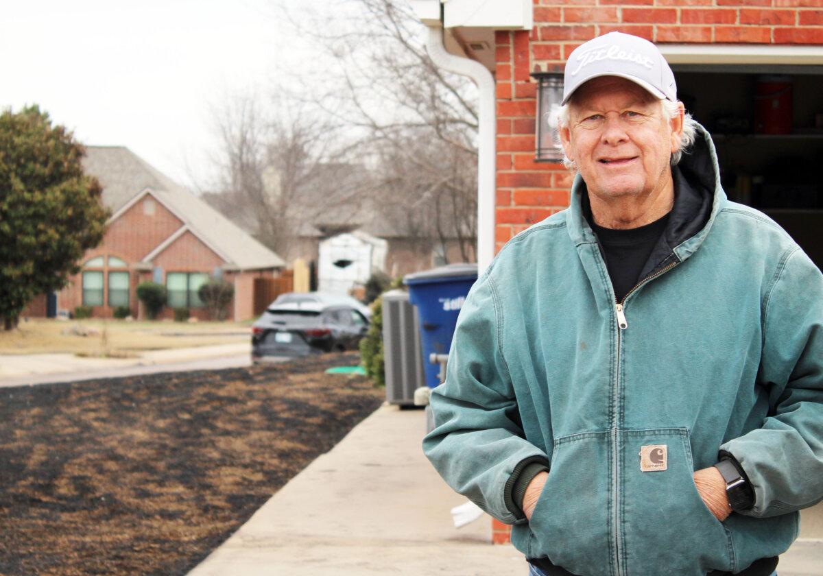 Ken Hudgeons stands in front of his house after wildfires ravaged his neighborhood in Stillwater, Okla., on March 15, 2025. (Michael Clements/The Epoch Times)