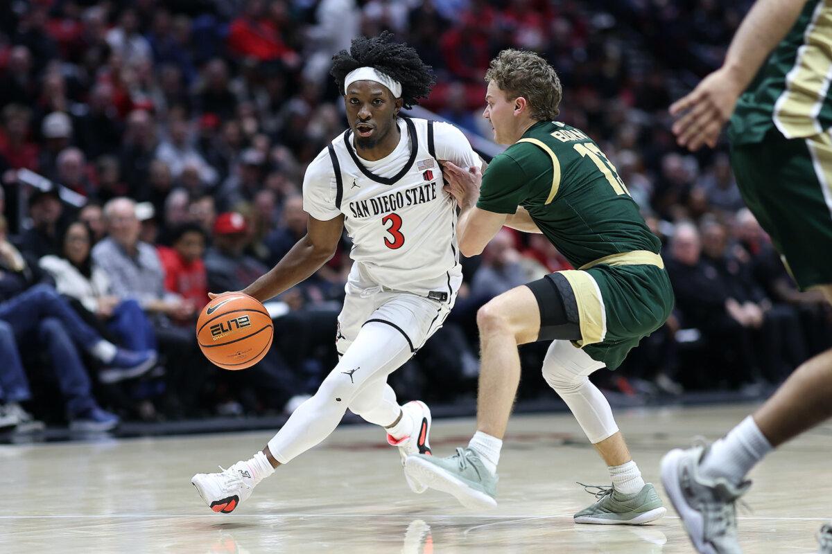 Wayne McKinney III #3 of Aztec, San Diego, dribbles past Bowen, a Bowen native of the Colorado Rams, in the first half of his match at Viejas Arena at San Diego State University on January 14, 2025.